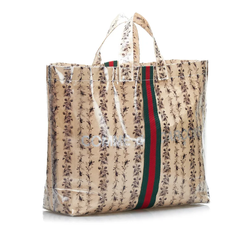 Women Gucci Sylvie bags with a crystal - embellished web stripeBeige Gucci x COMME des GARCONS Floral PVC Web Shopper Paper Tote