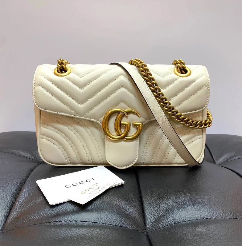 Women Gucci Sylvie bags featuring the signature web stripeGucci GG Marmont small cross-body bag white