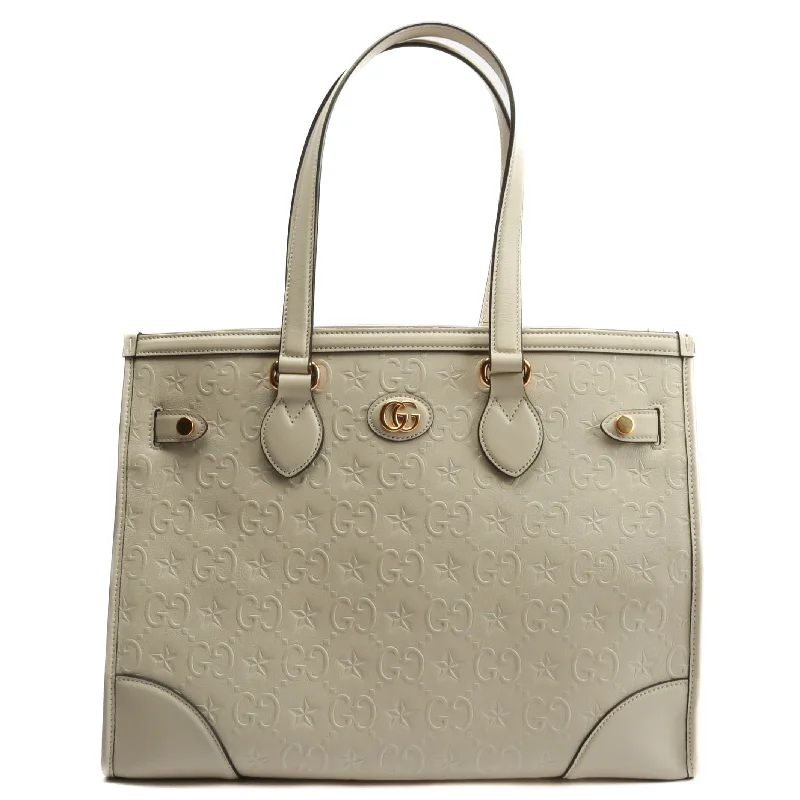 Gucci tote bags for women with a printed Gucci logoGUCCI GG Star Embossed Medium Tote w/Pouch - Ivory