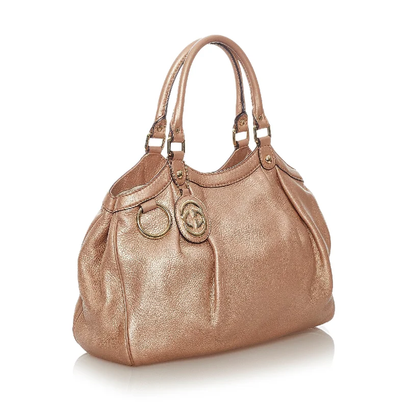 Ladies Gucci Dionysus bags with a star - shaped charmBeige Gucci Sukey Leather Tote Bag