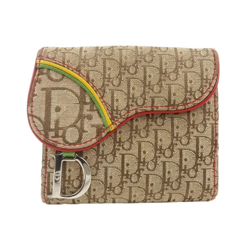 Christian Dior backpacks with a sleek, minimalist silhouetteChristian Dior Rasta Trotter Canvas Leather Saddle Compact Wallet