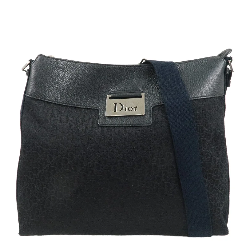 Christian Dior tote bags with a printed Dior logo on the frontChristian Dior Trotter Canvas Leather Shoulder Bag Black