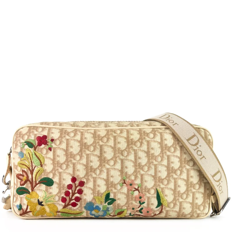 Christian Dior Saddle bags with a studded trim for a bold lookFlowers Monogram Canvas Embroidered Bag