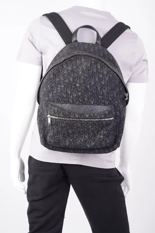 Christian Dior Saddle bags with a studded trim for a bold lookChristian Dior Mens Rider Backpack Black Canvas / Leather